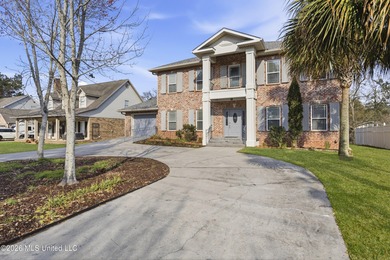 Welcome to this exceptional 4-bedroom, 5-bath custom waterfront on Sunkist Country Club, Inc. in Mississippi - for sale on GolfHomes.com, golf home, golf lot