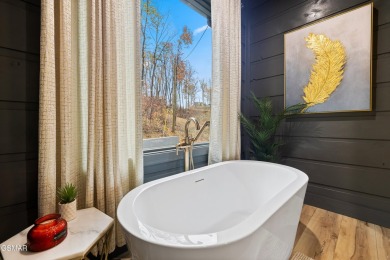 This brand-new construction, 4 BR, 5 BA pool cabin has recently on Bent Creek Golf Course in Tennessee - for sale on GolfHomes.com, golf home, golf lot