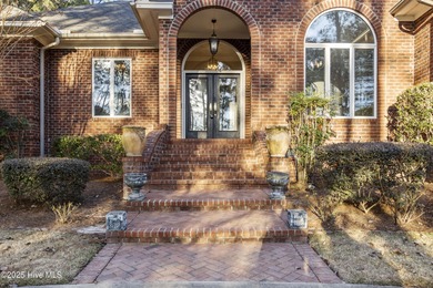 Welcome to this beautifully crafted single-story brick home in on Mid South Club in North Carolina - for sale on GolfHomes.com, golf home, golf lot