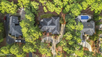 Welcome to this beautifully crafted single-story brick home in on Mid South Club in North Carolina - for sale on GolfHomes.com, golf home, golf lot