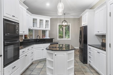 Welcome to this beautifully crafted single-story brick home in on Mid South Club in North Carolina - for sale on GolfHomes.com, golf home, golf lot