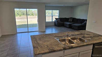 Unwind in paradise! This well-built D.R. Horton Cali one-story on Twisted Oaks Golf Club in Florida - for sale on GolfHomes.com, golf home, golf lot
