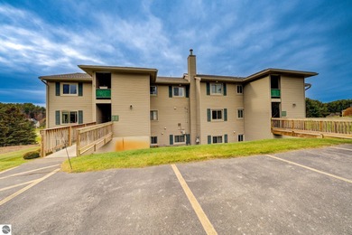 This turnkey lower level condo on 6th fairway of The Crown Golf on Bay Meadows Golf Course - Executive in Michigan - for sale on GolfHomes.com, golf home, golf lot