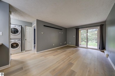 This turnkey lower level condo on 6th fairway of The Crown Golf on Bay Meadows Golf Course - Executive in Michigan - for sale on GolfHomes.com, golf home, golf lot