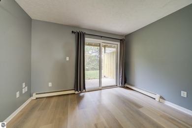 This turnkey lower level condo on 6th fairway of The Crown Golf on Bay Meadows Golf Course - Executive in Michigan - for sale on GolfHomes.com, golf home, golf lot