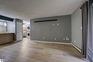 This turnkey lower level condo on 6th fairway of The Crown Golf on Bay Meadows Golf Course - Executive in Michigan - for sale on GolfHomes.com, golf home, golf lot