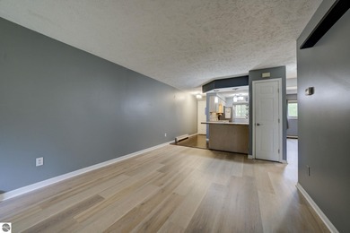 This turnkey lower level condo on 6th fairway of The Crown Golf on Bay Meadows Golf Course - Executive in Michigan - for sale on GolfHomes.com, golf home, golf lot