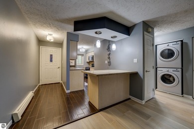 This turnkey lower level condo on 6th fairway of The Crown Golf on Bay Meadows Golf Course - Executive in Michigan - for sale on GolfHomes.com, golf home, golf lot