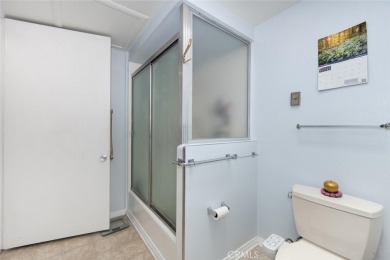 Drive-up location 1 bed/1 bath home with enclosed patio and on Leisure World Seal Beach Golf Course in California - for sale on GolfHomes.com, golf home, golf lot
