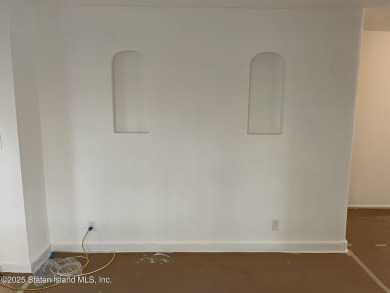A RARE opportunity to own a well-maintained, all brick 6 family on Silver Lake Golf Course in New York - for sale on GolfHomes.com, golf home, golf lot