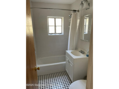 A RARE opportunity to own a well-maintained, all brick 6 family on Silver Lake Golf Course in New York - for sale on GolfHomes.com, golf home, golf lot