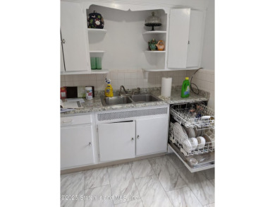 A RARE opportunity to own a well-maintained, all brick 6 family on Silver Lake Golf Course in New York - for sale on GolfHomes.com, golf home, golf lot