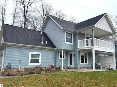 Welcome to 103 Ultra Court, a stunning golf course townhouse on Burning Oak Country Club in Michigan - for sale on GolfHomes.com, golf home, golf lot