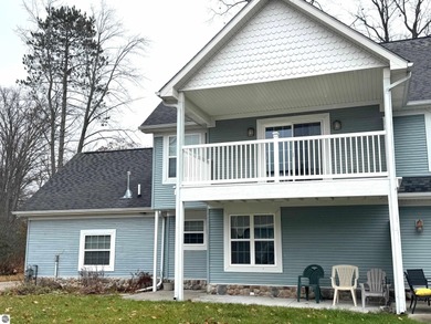 Welcome to 103 Ultra Court, a stunning golf course townhouse on Burning Oak Country Club in Michigan - for sale on GolfHomes.com, golf home, golf lot