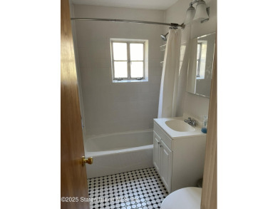 A RARE opportunity to own a well-maintained, all brick 6 family on Silver Lake Golf Course in New York - for sale on GolfHomes.com, golf home, golf lot