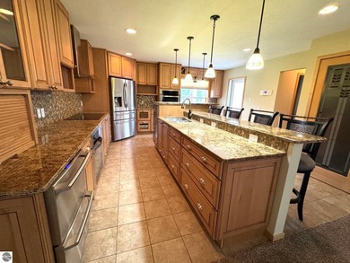 Welcome to 103 Ultra Court, a stunning golf course townhouse on Burning Oak Country Club in Michigan - for sale on GolfHomes.com, golf home, golf lot