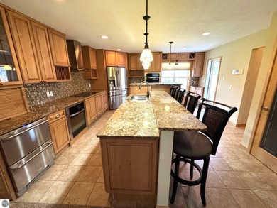 Welcome to 103 Ultra Court, a stunning golf course townhouse on Burning Oak Country Club in Michigan - for sale on GolfHomes.com, golf home, golf lot