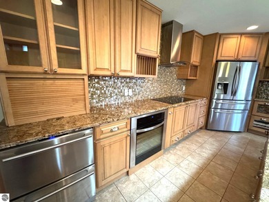 Welcome to 103 Ultra Court, a stunning golf course townhouse on Burning Oak Country Club in Michigan - for sale on GolfHomes.com, golf home, golf lot