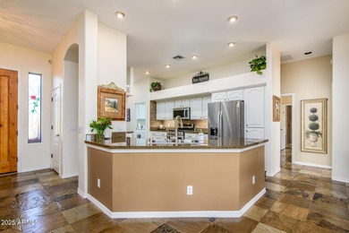 Welcome to this stunning Estrella custom home, situated on 1/2 on Estrella Mountain Ranch Golf Course in Arizona - for sale on GolfHomes.com, golf home, golf lot