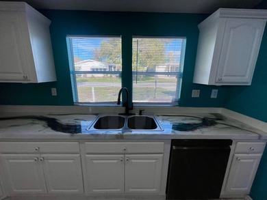 CHECK OUT THIS HOME in the sought after 55+ Gated Community of on Water Oak Country Club Estates in Florida - for sale on GolfHomes.com, golf home, golf lot