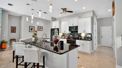 Perfectly positioned on the 12th tee of the south golf course in on Plantation Bay Golf and Country Club in Florida - for sale on GolfHomes.com, golf home, golf lot