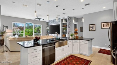 Perfectly positioned on the 12th tee of the south golf course in on Plantation Bay Golf and Country Club in Florida - for sale on GolfHomes.com, golf home, golf lot