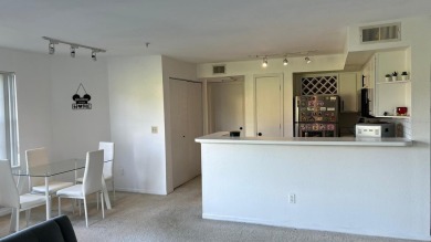 This meticulously maintained 2-bedroom, 2-bathroom apartment on MetroWest Golf Club in Florida - for sale on GolfHomes.com, golf home, golf lot