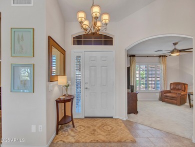 Beautifully maintained expanded Palmera model on the 14th green on Eagles Nest at Pebble Creek in Arizona - for sale on GolfHomes.com, golf home, golf lot