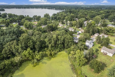 This buildable lot in Pleasant Bay Estates West offers the ideal on Hankerd Hills Golf Course in Michigan - for sale on GolfHomes.com, golf home, golf lot