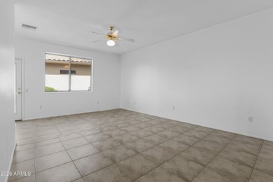 Located in The Point at The Grand in Surprise, this impeccably on Granite Falls Golf Club  in Arizona - for sale on GolfHomes.com, golf home, golf lot