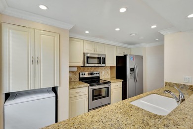 Rare first floor corner unit in Golf Villas, beautifully updated on PGA National Golf Club in Florida - for sale on GolfHomes.com, golf home, golf lot