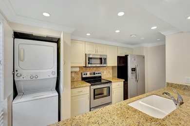 Rare first floor corner unit in Golf Villas, beautifully updated on PGA National Golf Club in Florida - for sale on GolfHomes.com, golf home, golf lot