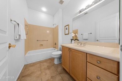 Located in The Point at The Grand in Surprise, this impeccably on Granite Falls Golf Club  in Arizona - for sale on GolfHomes.com, golf home, golf lot