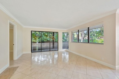 Rare first floor corner unit in Golf Villas, beautifully updated on PGA National Golf Club in Florida - for sale on GolfHomes.com, golf home, golf lot