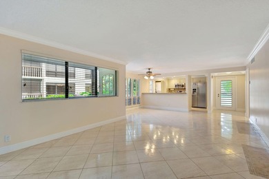 Rare first floor corner unit in Golf Villas, beautifully updated on PGA National Golf Club in Florida - for sale on GolfHomes.com, golf home, golf lot