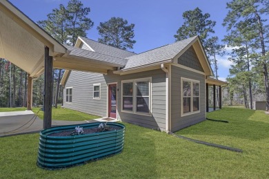 This charming 2-bedroom, 2-bath custom-built home sits on a on Rayburn Country Club in Texas - for sale on GolfHomes.com, golf home, golf lot