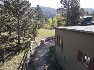 Charming mountain retreat located in the desirable Valle on El Valle Escondido Golf Course in New Mexico - for sale on GolfHomes.com, golf home, golf lot