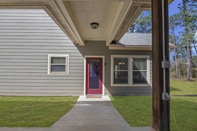 This charming 2-bedroom, 2-bath custom-built home sits on a on Rayburn Country Club in Texas - for sale on GolfHomes.com, golf home, golf lot