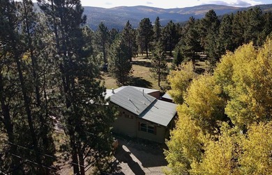 Charming mountain retreat located in the desirable Valle on El Valle Escondido Golf Course in New Mexico - for sale on GolfHomes.com, golf home, golf lot