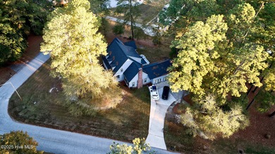 Located on a corner lot at Wilson Country Club overlooking Hole on Wilson Country Club in North Carolina - for sale on GolfHomes.com, golf home, golf lot