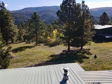 Charming mountain retreat located in the desirable Valle on El Valle Escondido Golf Course in New Mexico - for sale on GolfHomes.com, golf home, golf lot