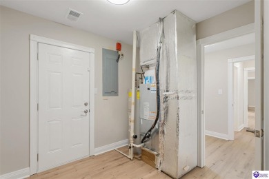 Welcome to this beautifully renovated 4-bedroom, 2.5-bath home on Elizabethtown Country Club in Kentucky - for sale on GolfHomes.com, golf home, golf lot