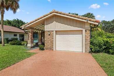 Tucked behind the gates of Boca Greens, this updated 2BD/2BA on Boca Greens Country Club in Florida - for sale on GolfHomes.com, golf home, golf lot
