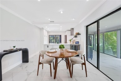 Tucked behind the gates of Boca Greens, this updated 2BD/2BA on Boca Greens Country Club in Florida - for sale on GolfHomes.com, golf home, golf lot