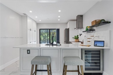 Tucked behind the gates of Boca Greens, this updated 2BD/2BA on Boca Greens Country Club in Florida - for sale on GolfHomes.com, golf home, golf lot