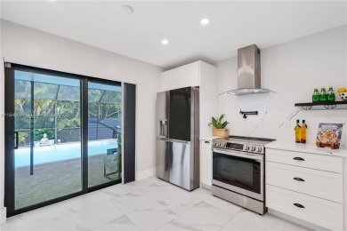 Tucked behind the gates of Boca Greens, this updated 2BD/2BA on Boca Greens Country Club in Florida - for sale on GolfHomes.com, golf home, golf lot