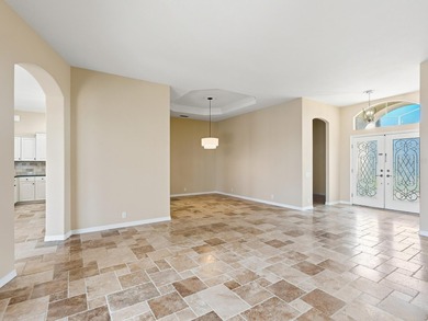 Enjoy tranquil lake views from this beautifully updated on Pelican Pointe Golf and Country Club in Florida - for sale on GolfHomes.com, golf home, golf lot