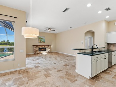 Enjoy tranquil lake views from this beautifully updated on Pelican Pointe Golf and Country Club in Florida - for sale on GolfHomes.com, golf home, golf lot