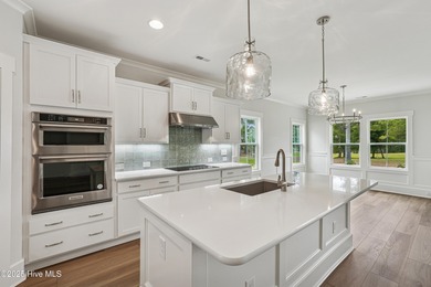 Discover the Skiff, a beautiful new Logan Home, located in on Sea Trail Golf Resort in North Carolina - for sale on GolfHomes.com, golf home, golf lot