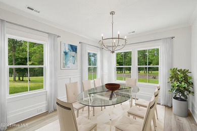 Discover the Skiff, a beautiful new Logan Home, located in on Sea Trail Golf Resort in North Carolina - for sale on GolfHomes.com, golf home, golf lot